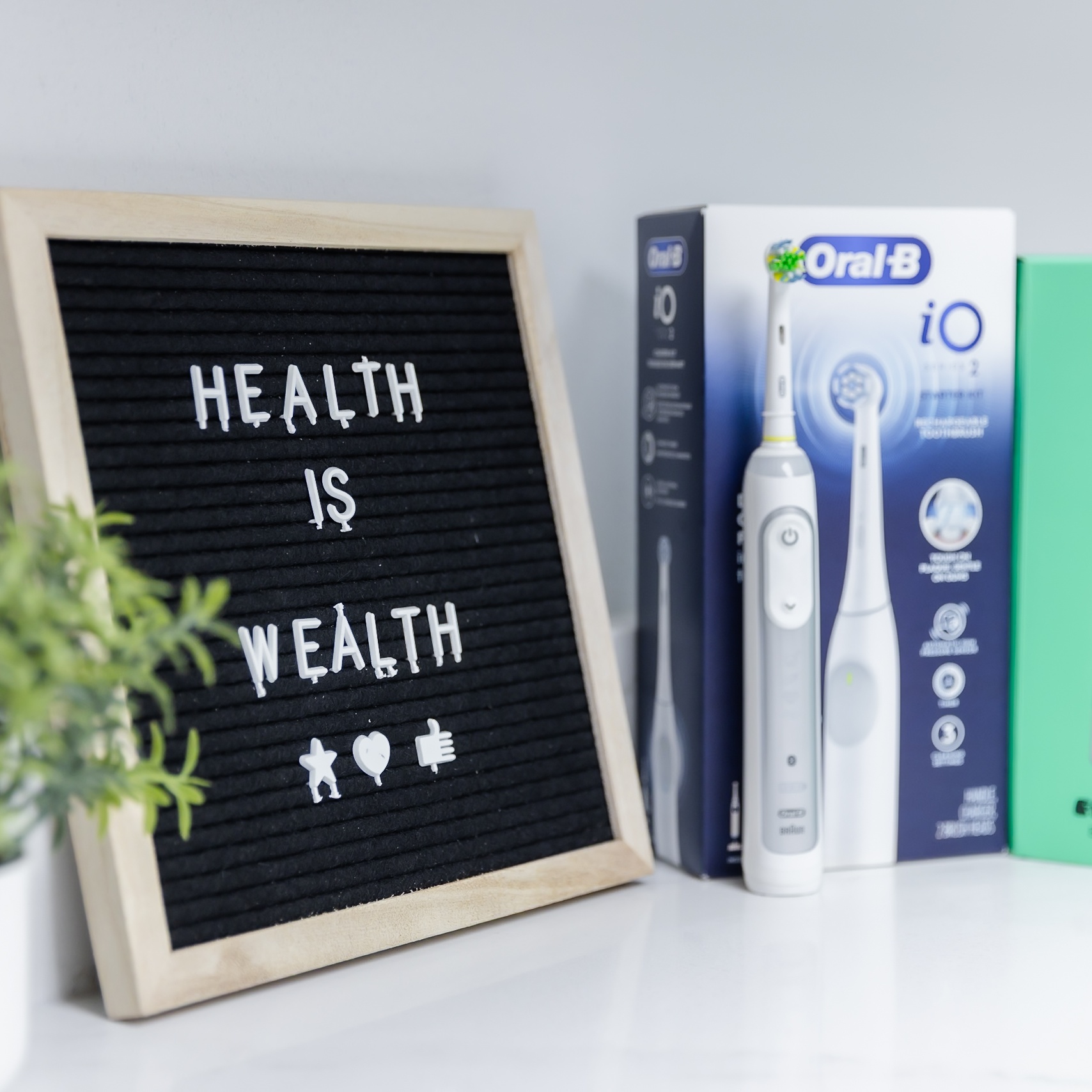 Health Is Wealth letter board with electric toothbrush and oral care products at Ganger Family Dentistry