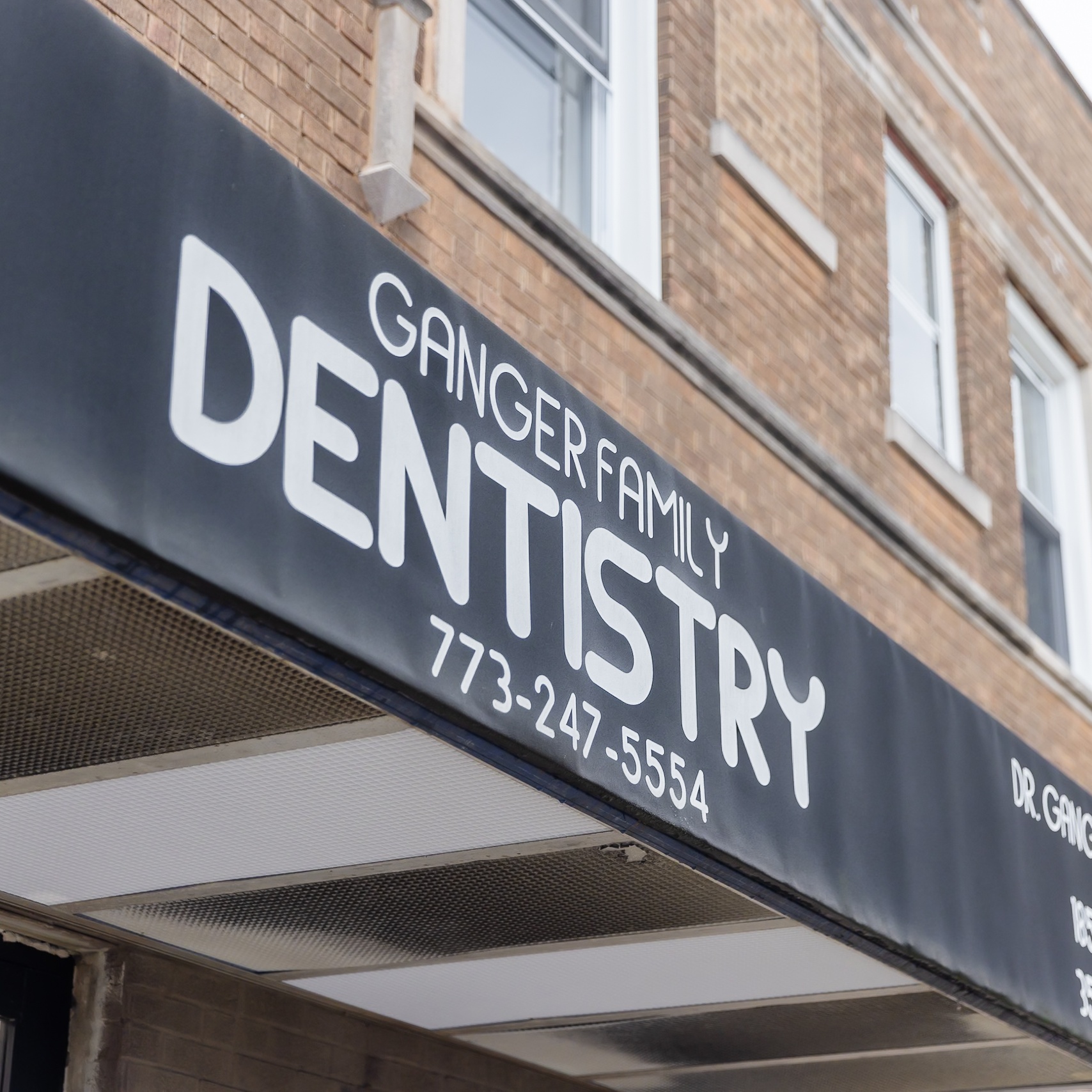 Exterior storefront of Ganger Family Dentistry at 1858 W 35th St, McKinley Park, Chicago — awning sign with phone number