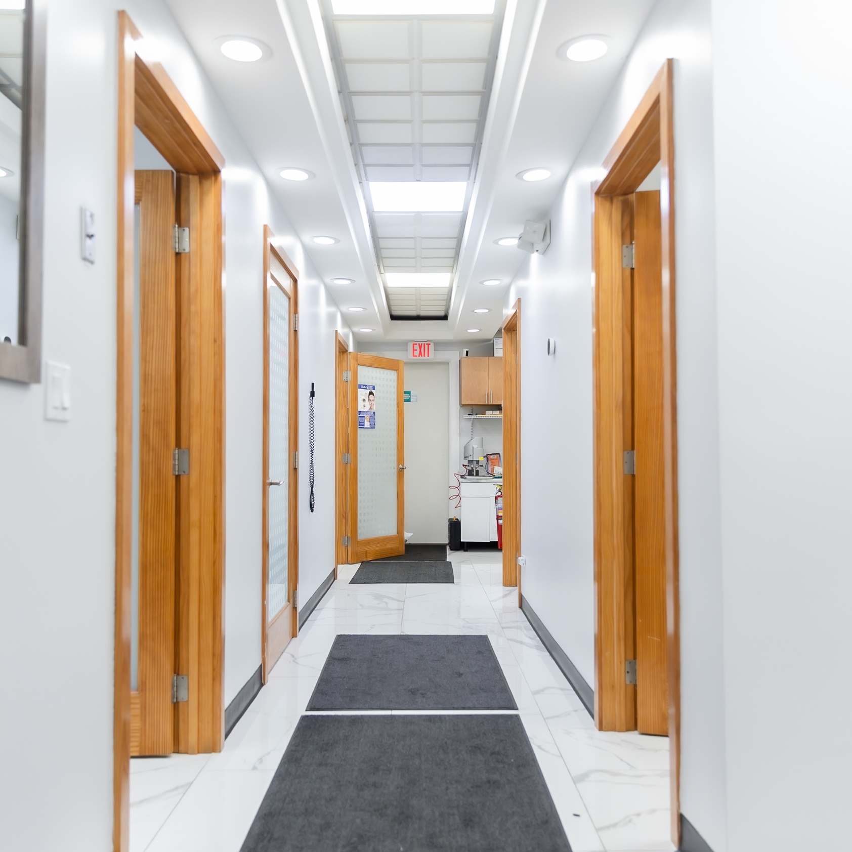 Bright hallway leading to multiple treatment rooms at Ganger Family Dentistry