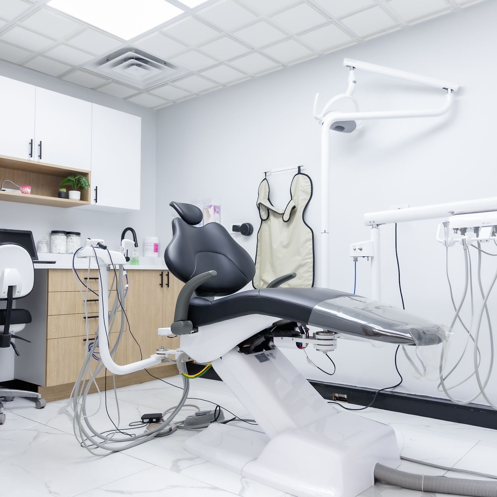 Modern dental treatment room with chair and equipment at Ganger Family Dentistry, Chicago